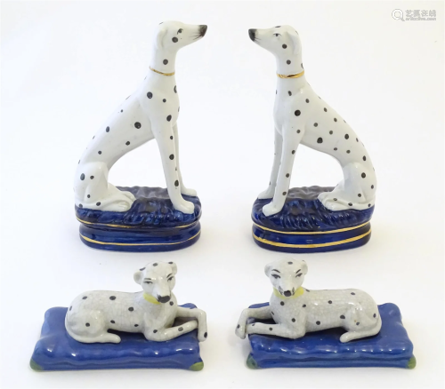 A pair of Staffordshire pottery models of seated Dalmatians ...