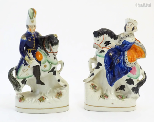A pair of Victorian Staffordshire pottery figures depicting ...