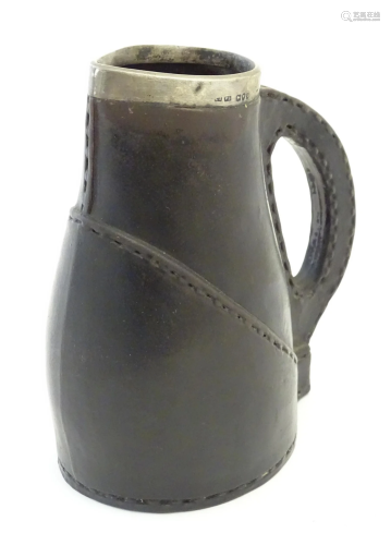 A Victorian Doulton Lambeth pottery jug formed as a leather ...
