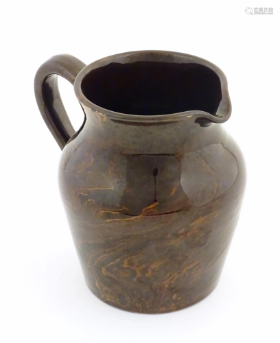An agate wear jug with loop handle. Approx. 4 1/2" high