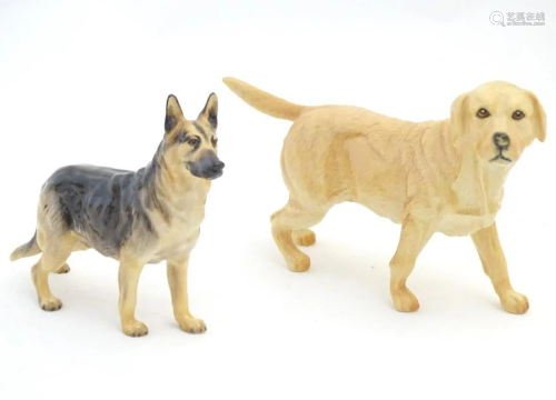 Two Royal Doulton models of dogs comprising a Golden Labrado...