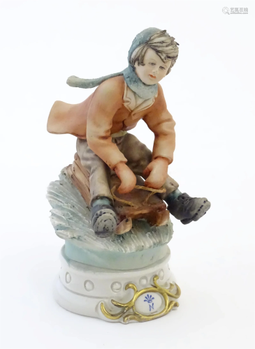 A Continental figure modelled as a boy on sledge. With Capod...