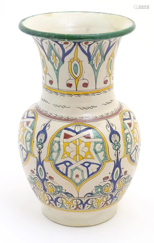 A 20thC Continental baluster vase with a flared rim decorate...