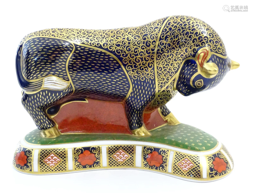 A Royal Crown Derby paperweight modelled as a Grecian Bull d...