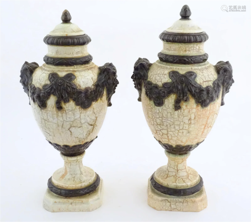 A pair of Continental lidded urns with faux marble ground, t...