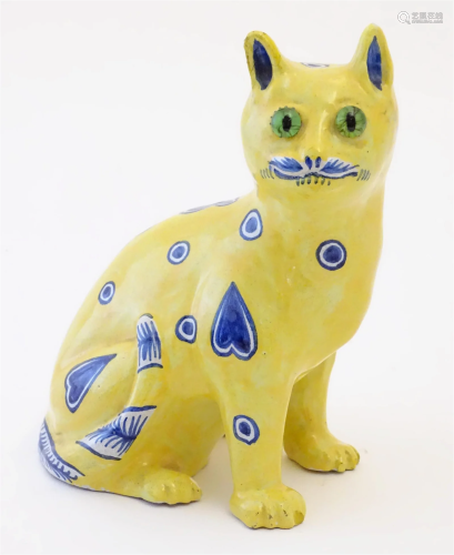 A 20thC model of a seated cat in the manner of Galle, with a...