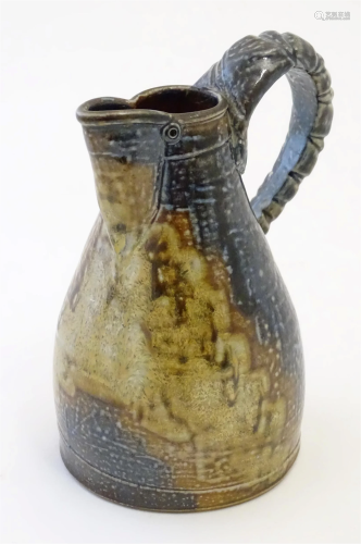 A studio pottery jug with loop handle by Mark Smith for Gree...