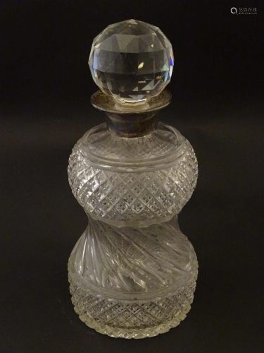 A cut glass decanter with silver collar hallmarked London 19...