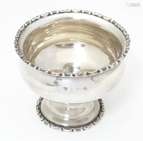 A silver sugar bowl with pedestal foot. Hallmarked Birmingha...