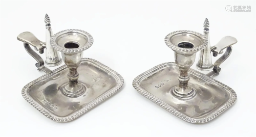 A pair of small Victorian silver chambersticks / taper stick...