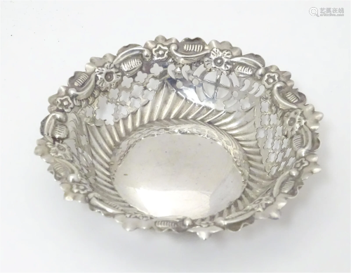 A Victorian silver bonbon dish with fretwork decoration. Hal...