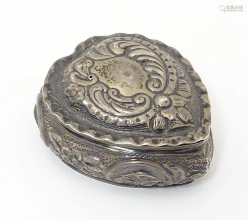 A Victorian silver box of heart form with hinge lid and gild...