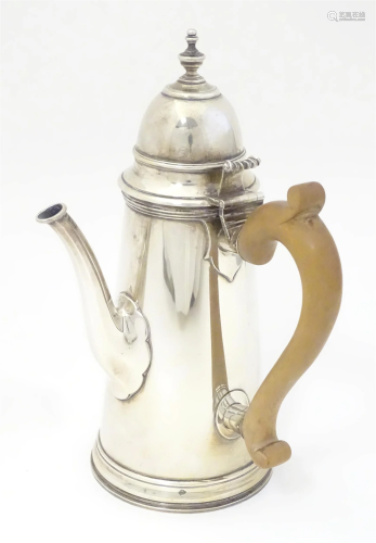 A George V silver chocolate pot with wooden side handle and ...