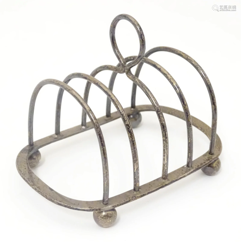 A silver five bar toast rack, hallmarked London 1906, maker ...
