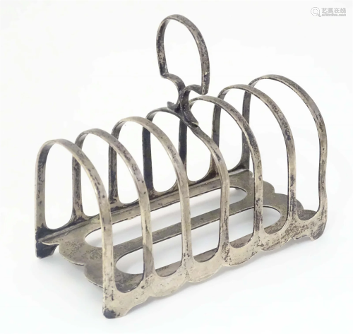 An Art Deco silver seven bar toast rack, hallmarked Sheffiel...