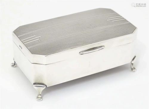 An Art Deco silver jewellery box with engine turned decorati...