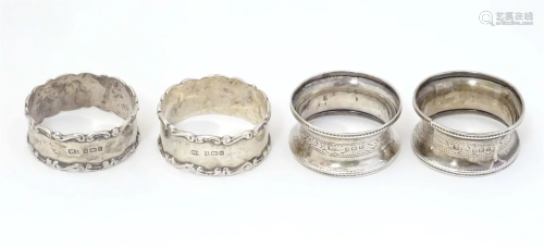 Two pairs of silver napkin rings, one pair hallmarked Birmin...