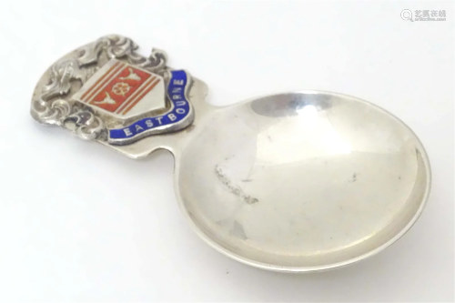 A silver souvenir caddy spoon with Eastbourne crest / armori...