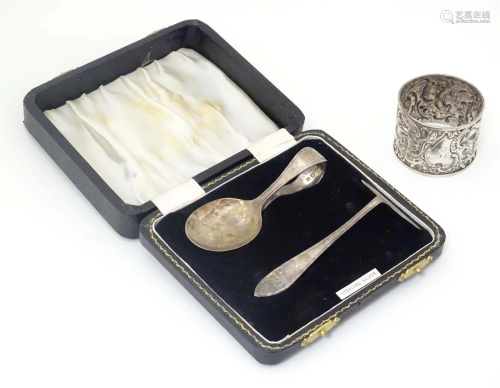 A child's silver spoon and pusher hallmarked Birmingham...
