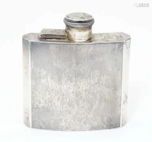 An Art Deco silver hip flask with engine turned decoration, ...