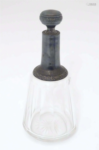 A French facet cut glass liquor decanter / flask with silver...