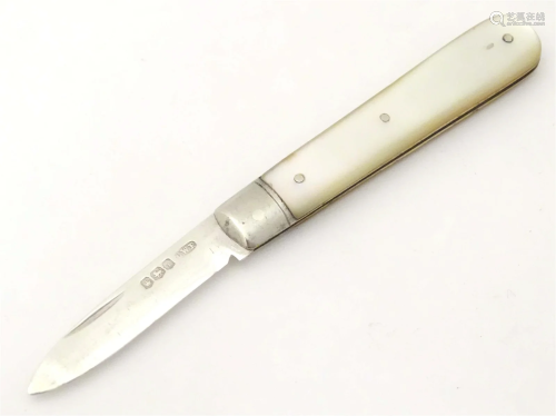 A silver folding fruit knife with mother of pearl handle, ha...