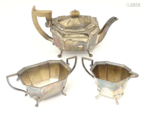 An Art Deco silver three piece tea set comprising tea pot, s...
