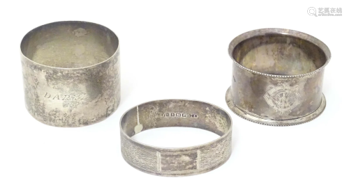 Three silver napkin rings comprising on hallmarked Birmingha...