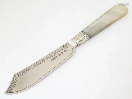 A Victorian silver butter knife with mother of pearl handle,...