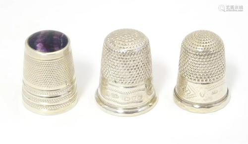 Three assorted silver thimbles including one with inset Blue...