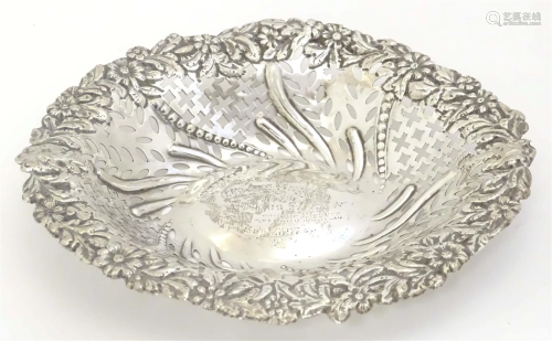 A Victorian hallmarked silver bon bon dish with embossed and...