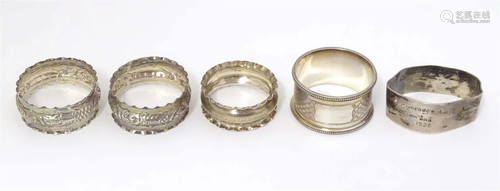 4 assorted napkin rings to include a pair hallmarked Birming...