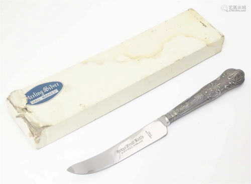 Silver handled grapefruit knife with stainless steel blade. ...