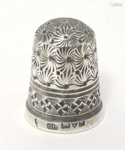 A silver thimble hallmarked Chester 1906 maker Charles Horne...