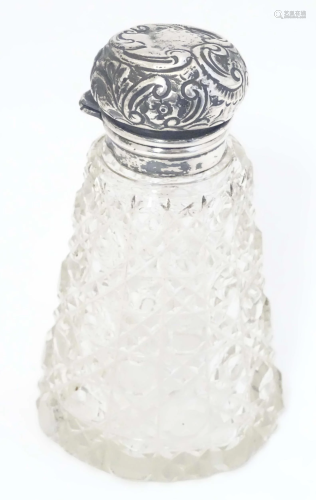 A cut glass perfume / scent bottle with silver mount hallmar...