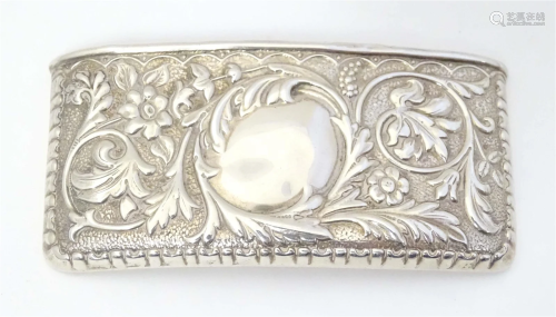 A silver card case with embossed decoration. hallmarked Birm...