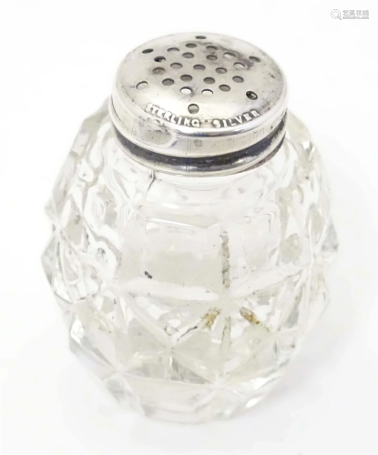 A glass pepper pot with lid marked Sterling Silver 2" h...