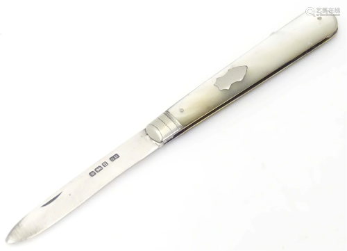 A folding silver fruit knife with mother of pearl handle. Ha...