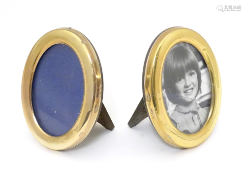 Two oval photograph frames with Continental silver gilt surr...