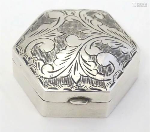 A silver pill box of hexagonal form marked .925. 1 1/2"...