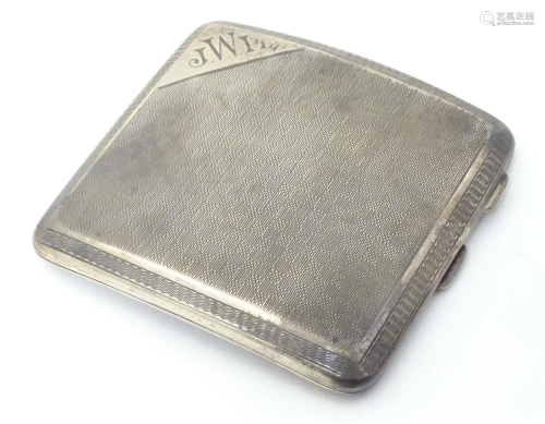 A silver cigarette case with engine turned decoration. Hallm...