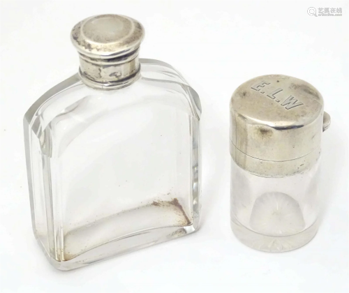 Two glass dressing table scent bottles , one with hinged sil...