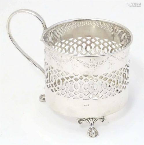 A silver tisane cup / beaker holder with loop handle and thr...