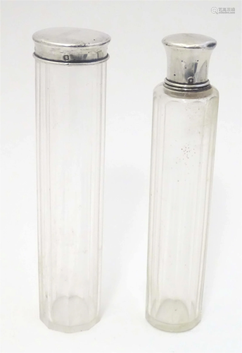 Two glass dressing table bottle / toilet jars with French si...