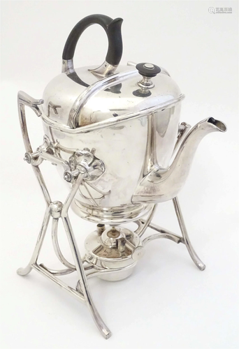 A silver plate SYP (Simple Yet Perfect) teapot on stand with...