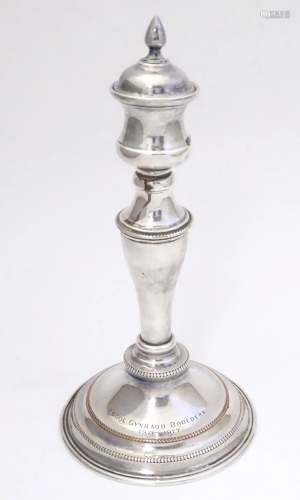 A 20thC Welsh silver plate candlestick marked under ' M...