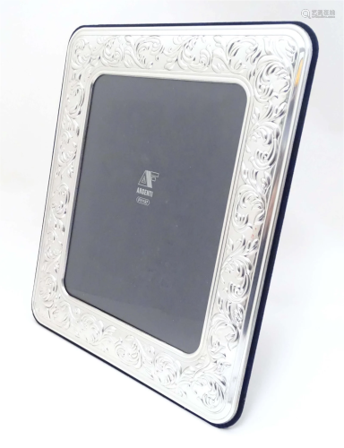 An Italian photograph frame with easel back and white metal ...