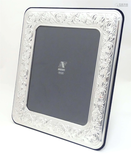 An Italian photograph frame with easel back and white metal ...