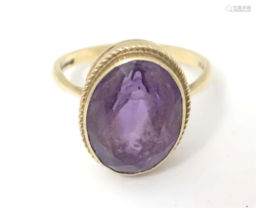 A 9ct gold ring set with facet cut amethyst. Amethyst approx...