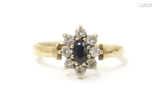 A 9ct gold ring set with central spinel bordered by cubic zi...